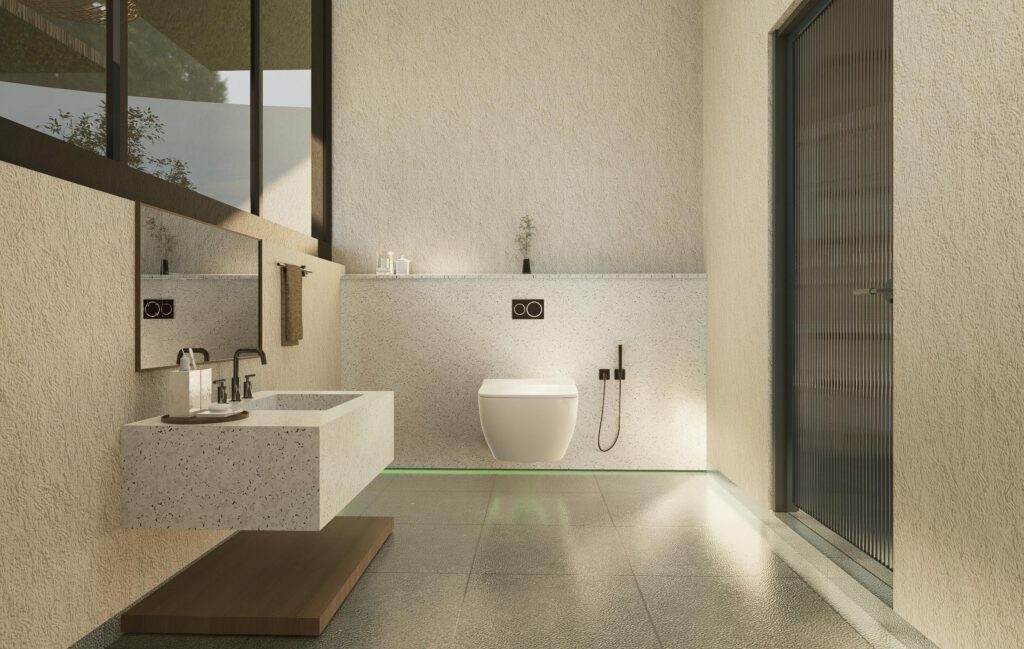 Sand colored modern bathroom with sink and toilet