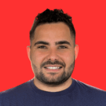Headshot of owner against a bright orange background